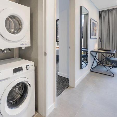 Meriton Suites Melbourne City Exterior foto Laundry facilities in a typical apartment