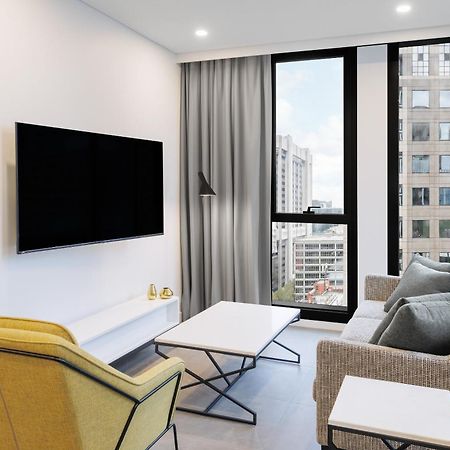 Meriton Suites Melbourne City Exterior foto A living room