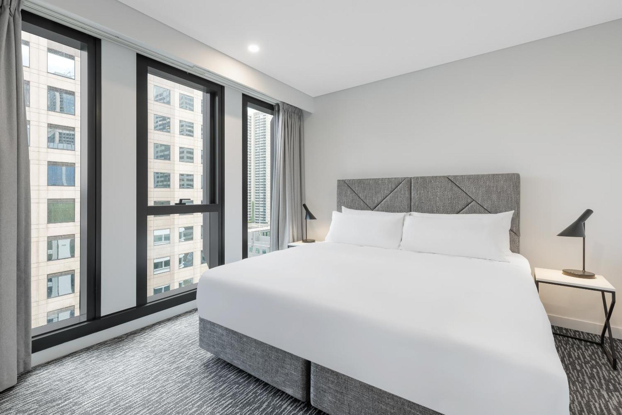 Meriton Suites Melbourne City Exterior foto A bedroom at the hotel