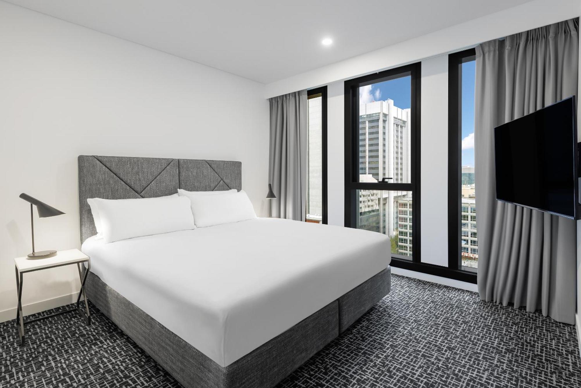 Meriton Suites Melbourne City Exterior foto A bedroom at the hotel
